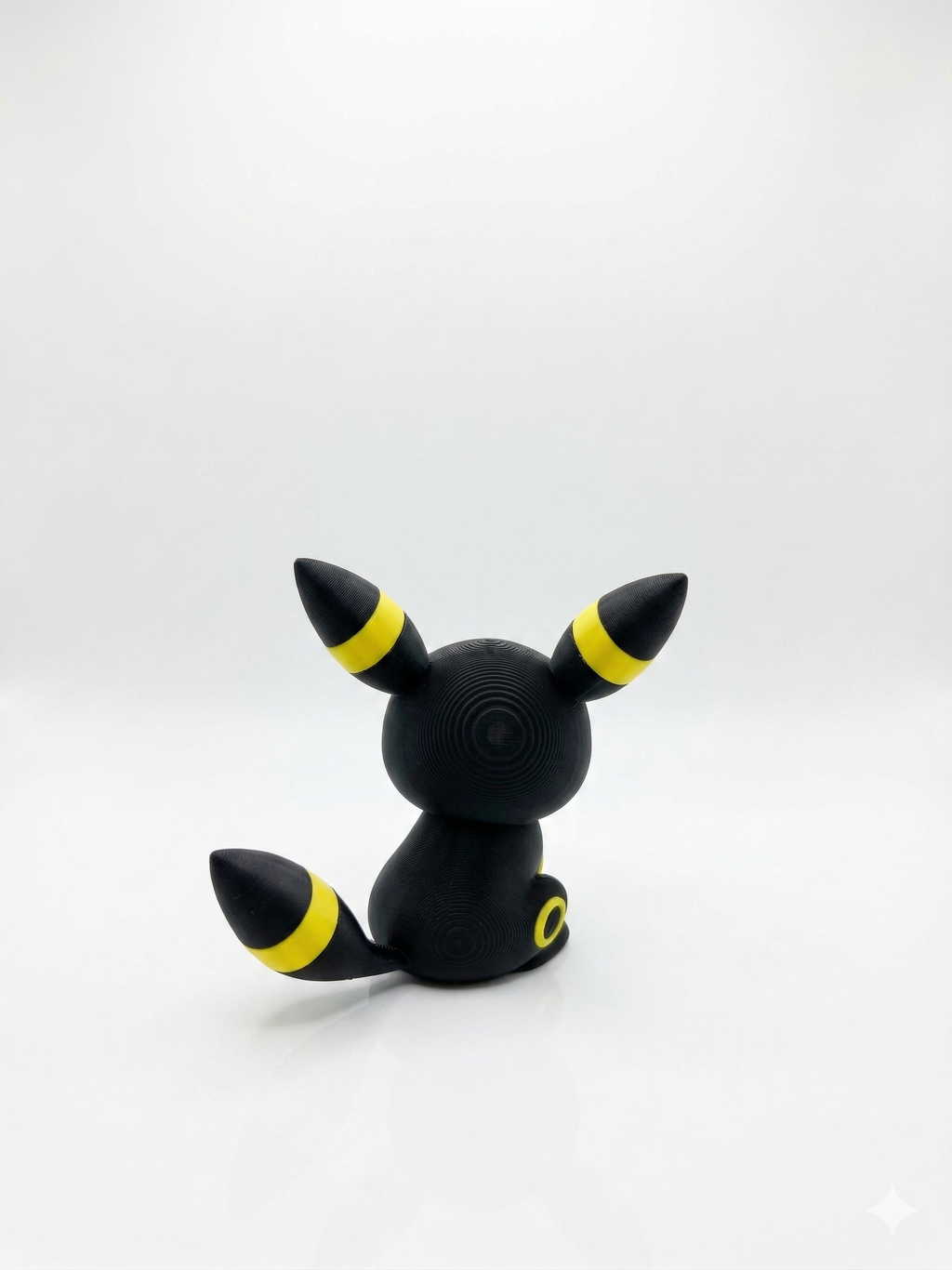 Black and yellow character with pointed ears on a white background, pokemon, chibi, umbreon, 3d print