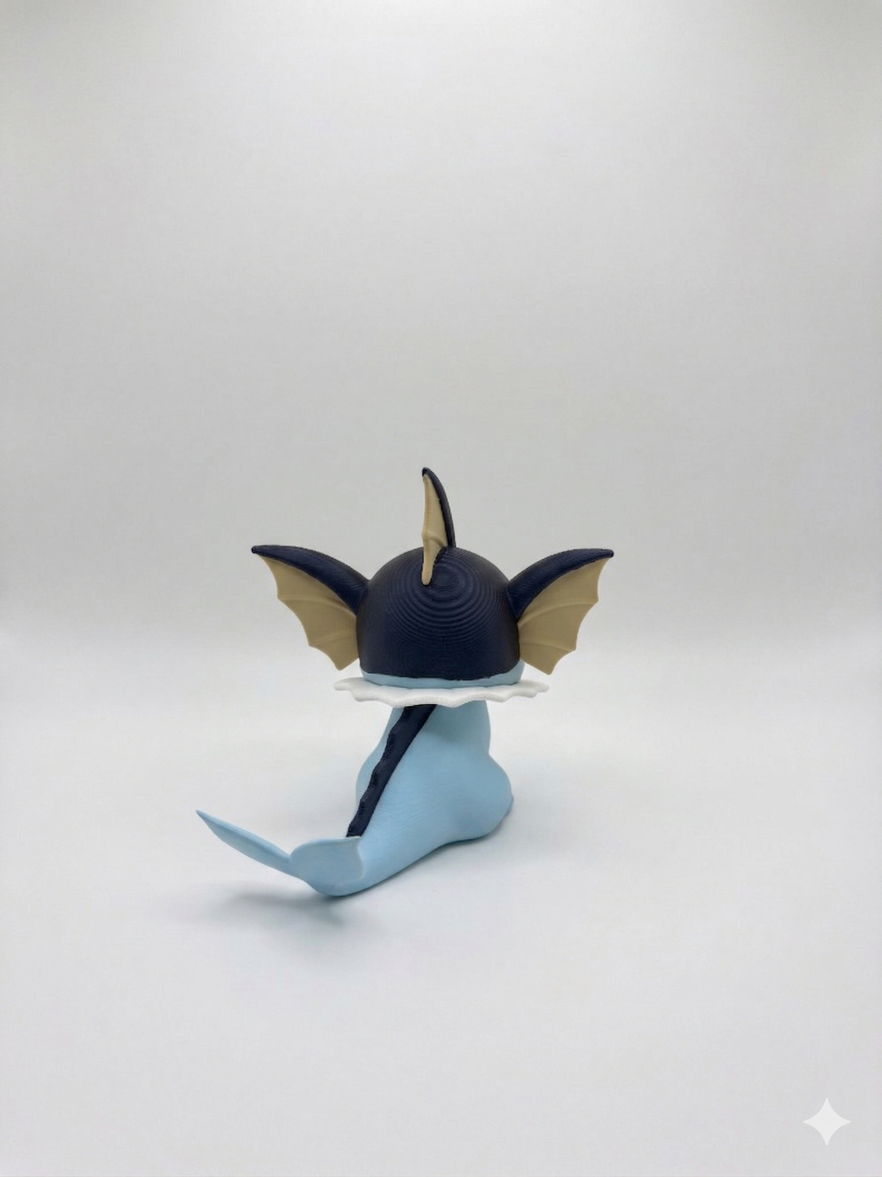 Blue and black fish-shaped object on a white background, pokemon, 3d print, chibi, vaporeon, model, figurine